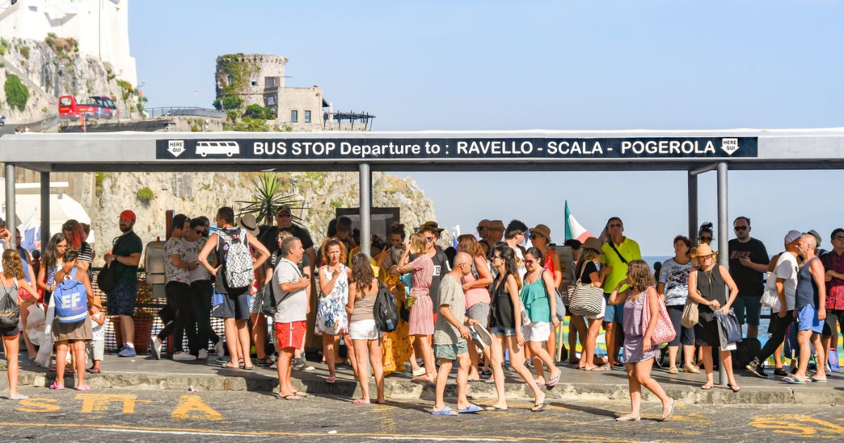passengers waiting for bus at bus stop in amalfi